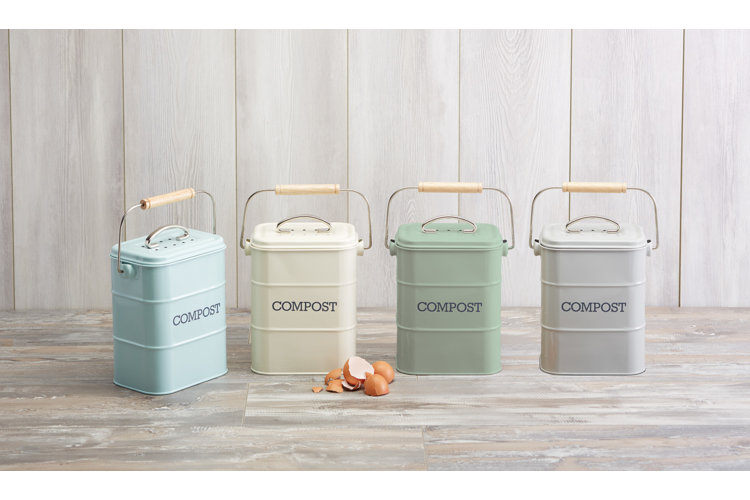 four different pastel-hued kitchen counter compost bins