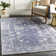 Tapis bleu à motif géométrique Longlier