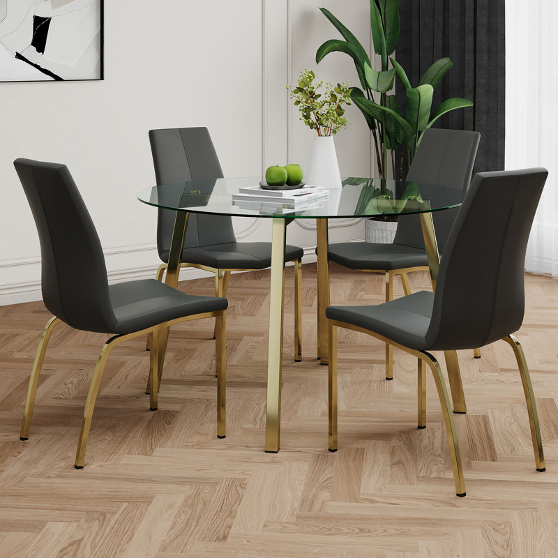 Table de cercle moderne en verre de style moderne, design transparent élégant, ensemble de chaises de salle à manger en polyuréthane à base de support durable, pieds de chaise plaqués or, convient aux cuisines de restaurant (ensemble de 5)