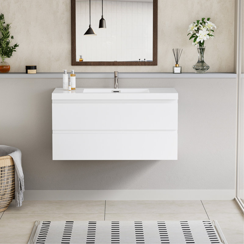 Meuble-lavabo flottant avec lavabo, mural et peu encombrant, idéal pour la conception et l'organisation de salles de bain modernes.