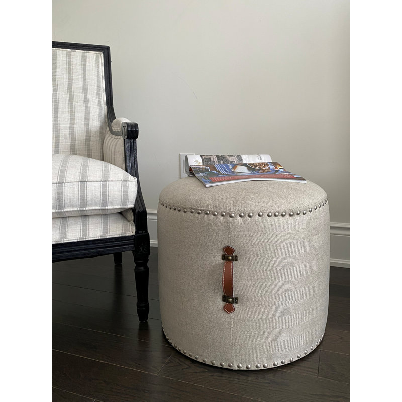 Johnny Fabric Upholstered Round Pouf Ottoman with Faux Leather Handle, Beige Polyester