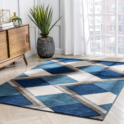 Tapis bleu à motif géométrique de losanges