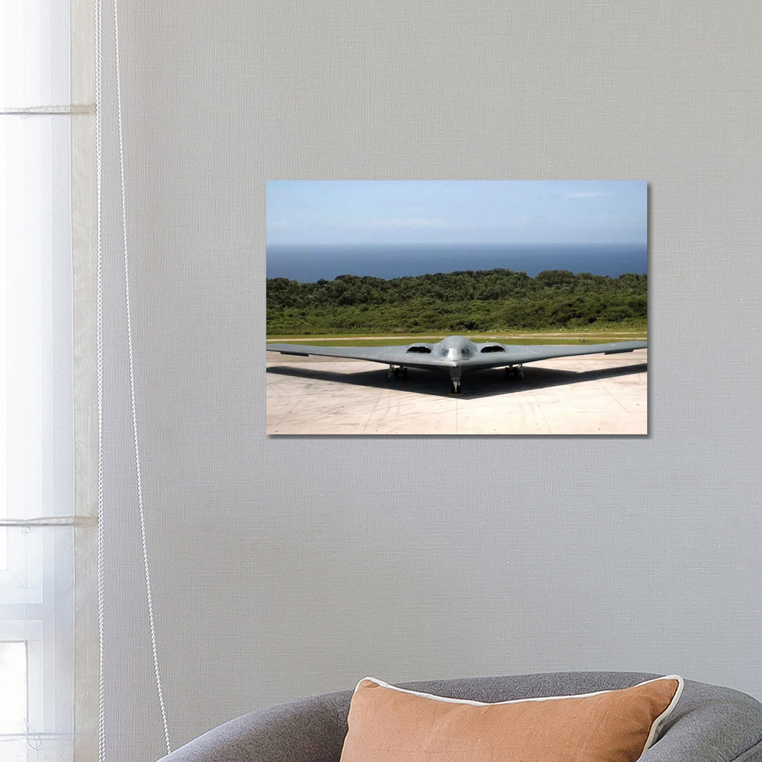A B-2 Spirit Stealth Bomber Waits On The Flightline - Wrapped Canvas Print