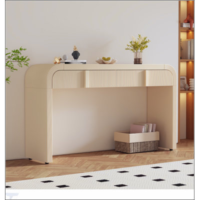 Console unique à silhouette arrondie et à surface lisse avec tiroirs spacieux et pieds réglables