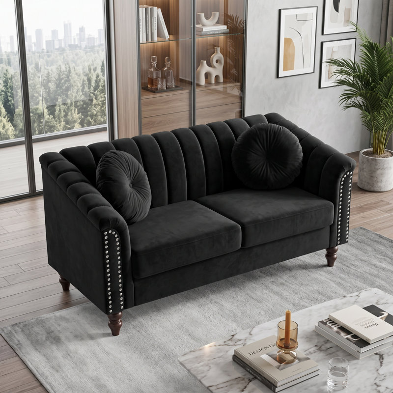 Canapé deux places noir capitonné, accoudoirs arrondis et garniture cloutée, Loveseat