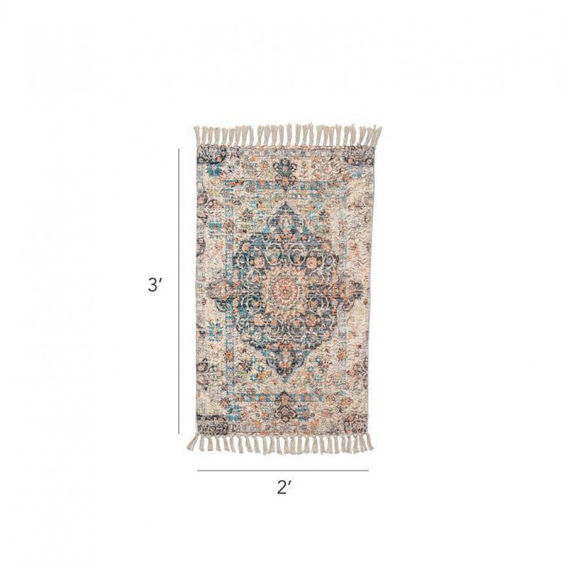 Tapis de sol bleu et ivoire avec franges