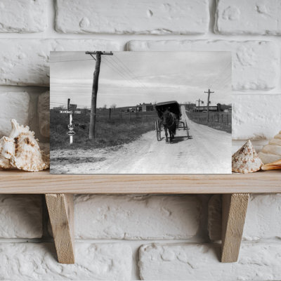 1920s 1930s AMISH MAN DRIVING BUGGY DOWN RURAL DIRT ROAD IN FARM COUNTRY by H. Armstrong Roberts - Wrapped Canvas Print