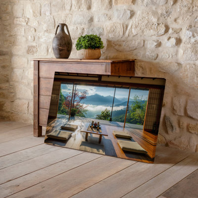 Toile, salon de thé japonais serein avec plancher en bois et art mural, coussins bas disposés autour d'une table centrale ornée d'un art mural sur toile