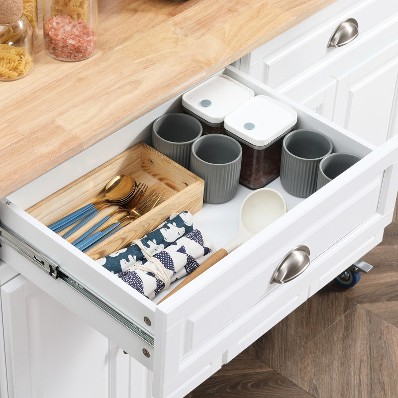 Îlot de cuisine roulant blanc avec abattant en bois massif. Rangement copieux: tiroirs, armoires et étagère à épices. Comptoir pliable pour économiser de l'espace. Comptoir mobile à roues verrouillables