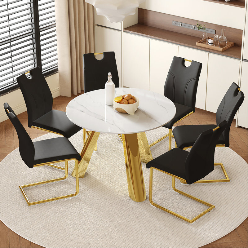 Ensemble de salle à manger moderne 42 po en pierre frittée de luxe avec base en métal doré et 4 chaises rembourrées en polyuréthane noir Elegant Contemporary