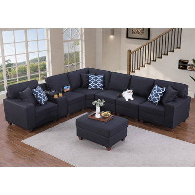 Canapé modulaire en cuir artificiel avec repose-pieds et console Gina Gina