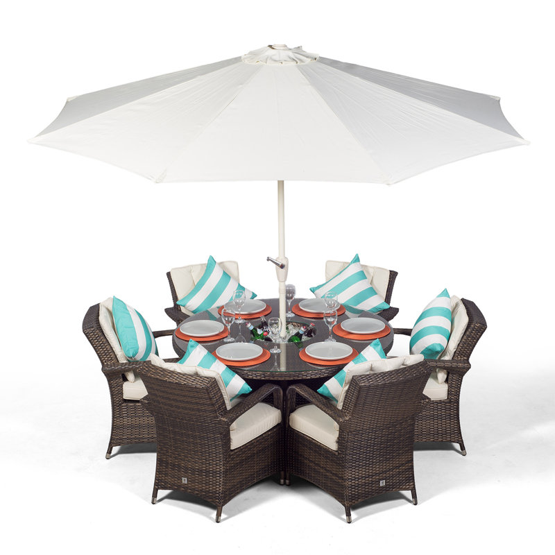 Karas 6 - Person Wicker Patio Dining Set with Round Table , Cushions Included, Brown