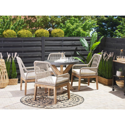 Monsey 4 - Person Patio Dining Set Round Table with Cushions Included