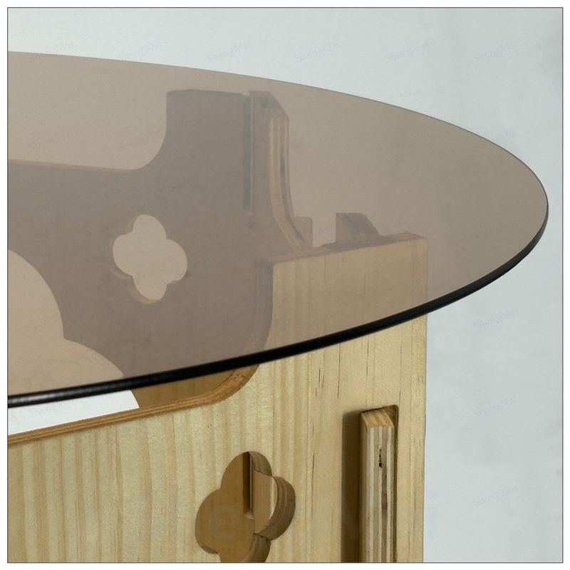 Table basse ronde avec plateau en verre trempé et nid de chat caché, conception compacte pour les maisons modernes
