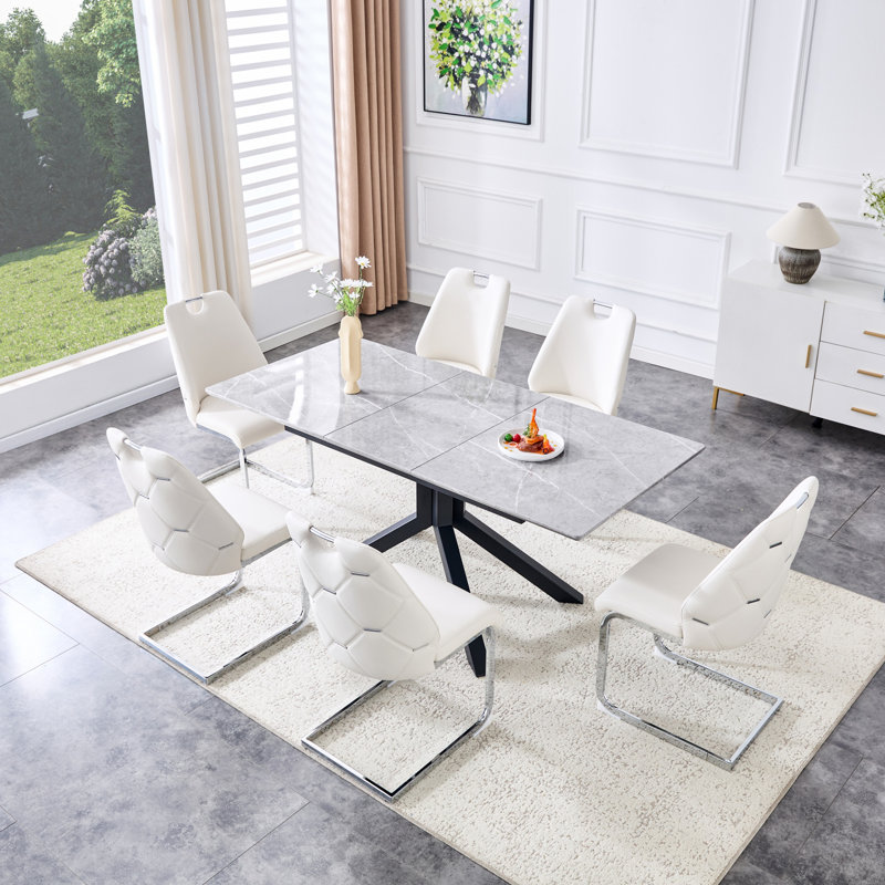 Table de salle à manger contemporaine en bois aggloméré extensible et 4 chaises à dossier en similicuir, parfaites pour les réunions de famille modernes et peu encombrantes