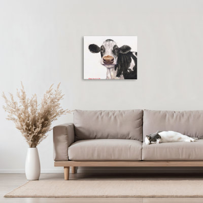 Vache mignonne avec toile à pois blancs, design par George Dyachenko