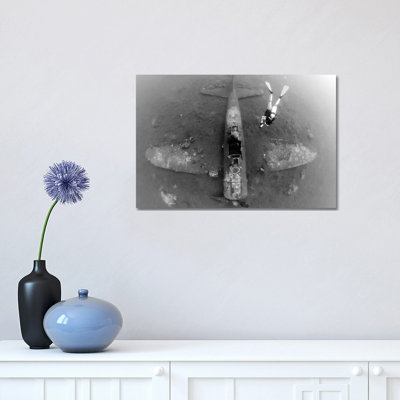 Diver Explores The Wreck Of A Mitsubishi Zero Fighter Plane by Steve Jones - Wrapped Canvas Print
