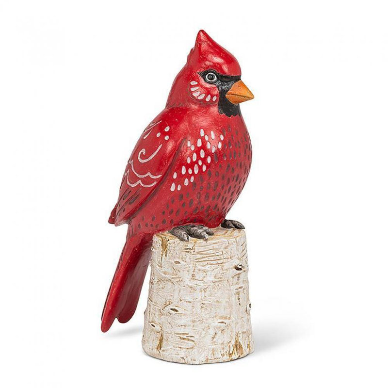 Figurine cardinal sur une souche de bouleau