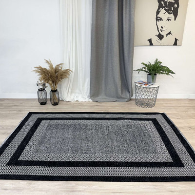 Tapis en coton tissé noir Alfa Rich Candelario