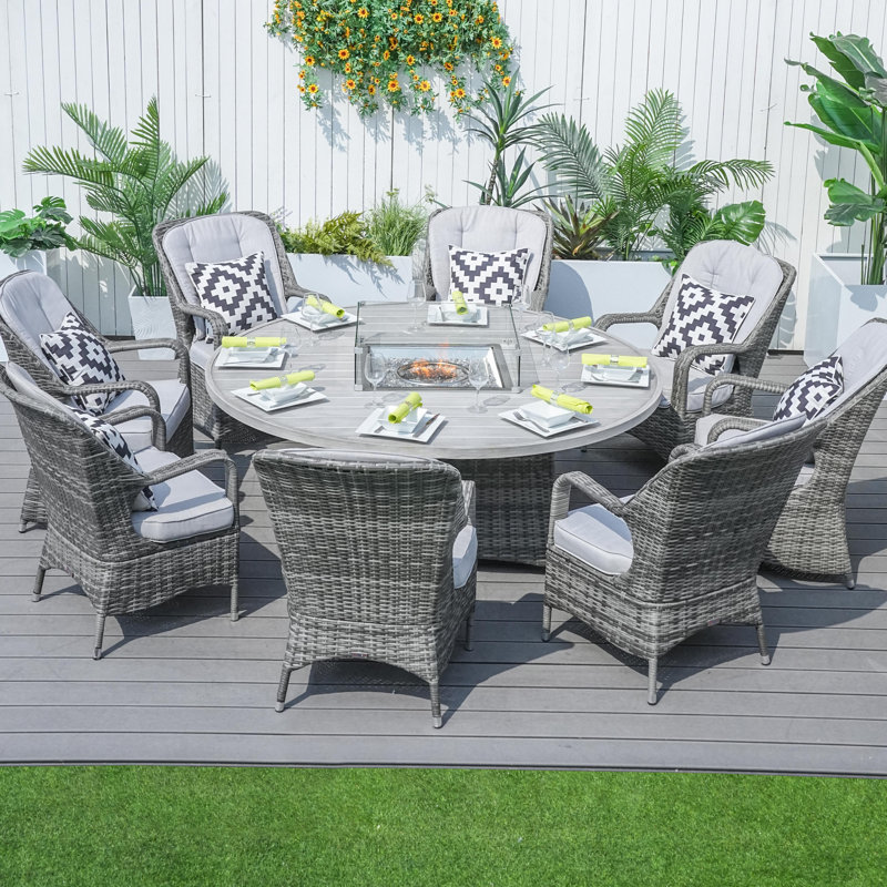 Natascha 8 - Person Wicker Patio Dining Set with Round Table , Cushions Included, Gray