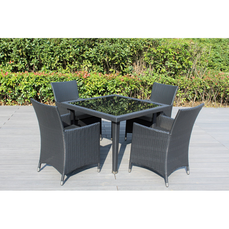 Lumini 4 - Person Wicker Patio Dining Set with Square Table , Cushions Included, Supercrylic Gray
