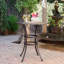 Table de bar en fonte d'aluminium avec motif en treillis et porte-parapluie pour un repas en plein air élégant
