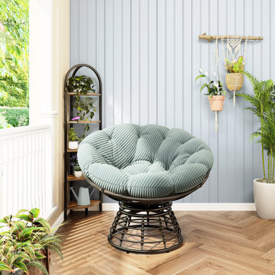 Fauteuil pivotant confortable à 360° avec coussin épais et structure brune, idéal pour se détendre à l'intérieur comme à l'extérieur, dans le salon ou la chambre. Design ergonomique et moelleux, parfait pour la lecture chez les adultes.