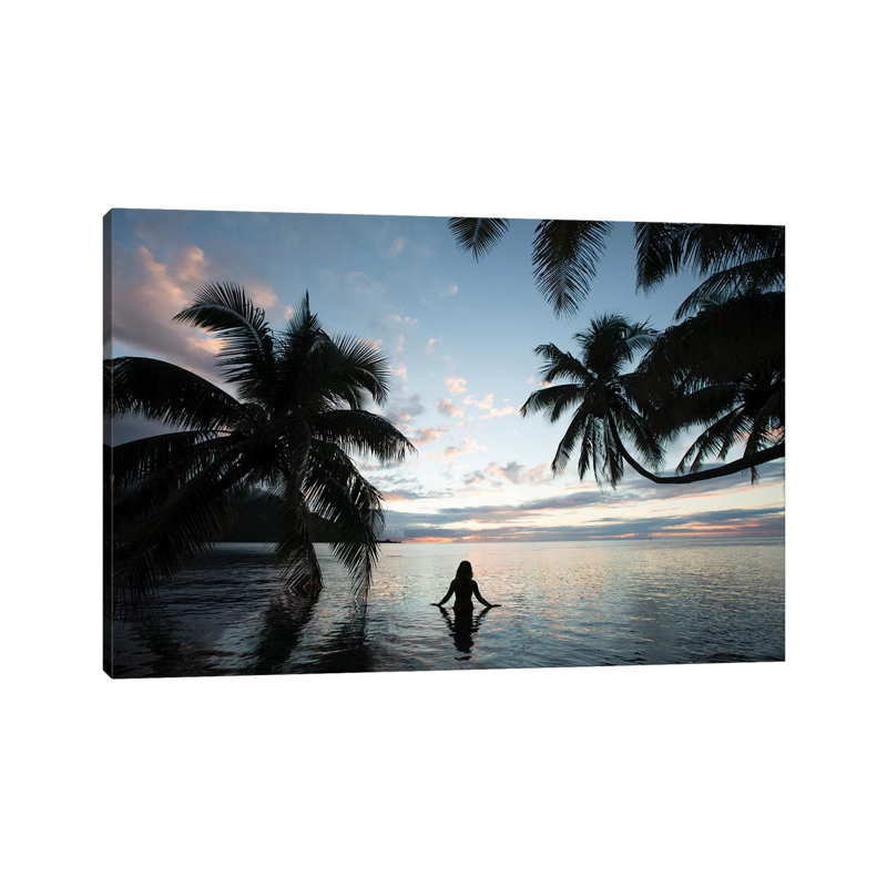 Woman Standing In The Pacific Ocean At Sunset, Moorea, Tahiti, French Polynesia III by Panoramic Images - Wrapped Canvas Print