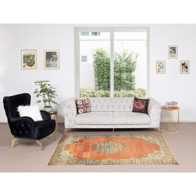 Tapis oriental fait à la main en rouge, brun, crème et bleu
