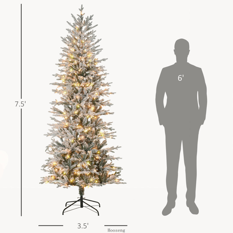Arbre de Noël pré-éclairé avec branches enneigées et lumières jaunes chaudes