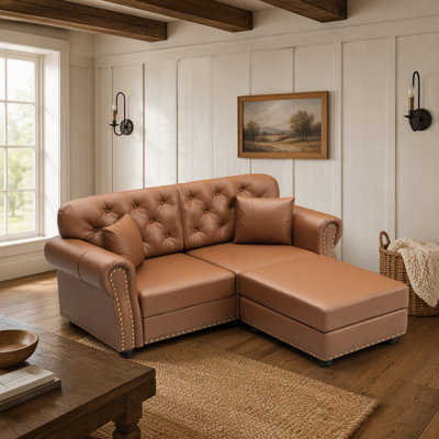 63-Inch Upholstered Faux Leather Sofa with Button Tufting, Nailhead Trim, Rolled Arms, and Two Decorative Pillows for Timeless Comfort and Modern Eleg
