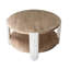 Table basse ronde en bois avec finition brun naturel, pieds sculptés blancs et tablette de rangement inférieure