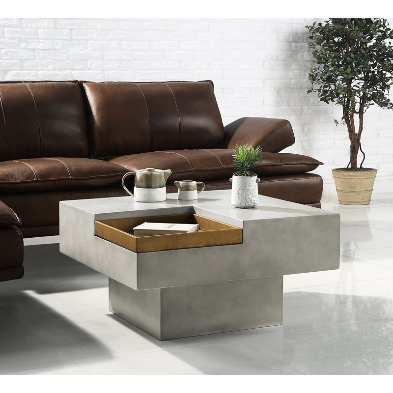 Merveilleuse table basse en ciment gris avec rangement pratique de style industriel avec matériau et surface