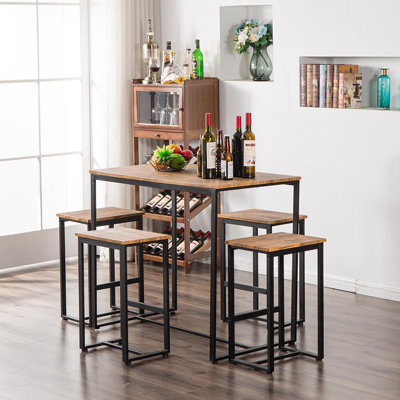 Britney 4 - Person Trestle Base Dining Set