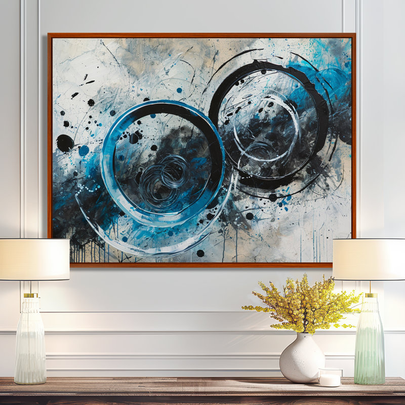 Cercles noirs fusionnant des éclaboussures bleues - spirale abstraite, art mural, Toile avec cadre flottant noir