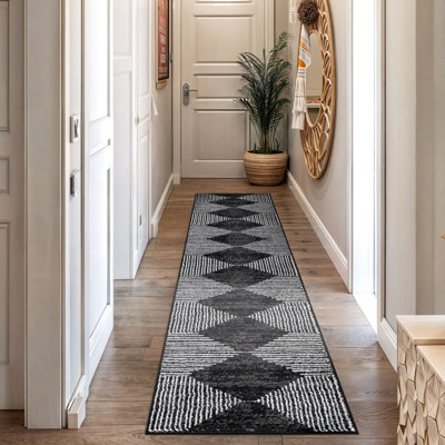 Tapis noir à rayures géométriques ivoire