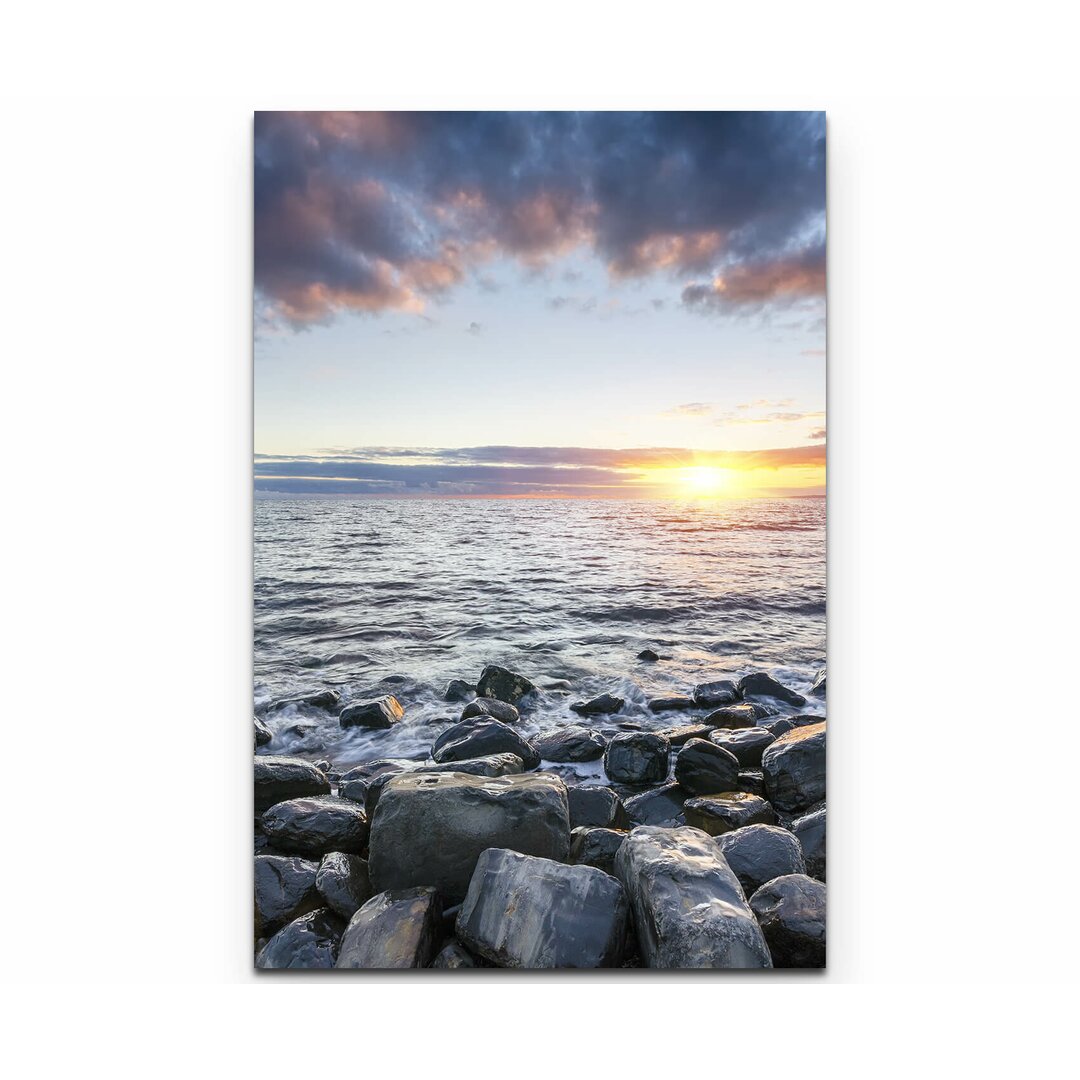 Leinwandbild Steinstrand bei Sonnenuntergang