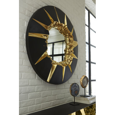 Miroir circulaire craquelé, noir et or