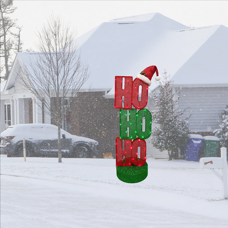 Figurine "HOHOHO" avec chapeau de père Noël