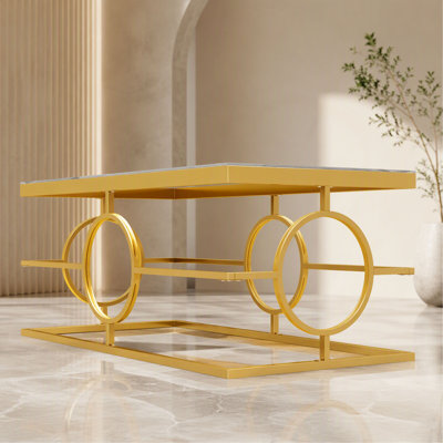 Table basse moderne et luxueuse en verre avec structure en métal, table basse rectangulaire à base géométrique circulaire, table centrale glamour pour salon