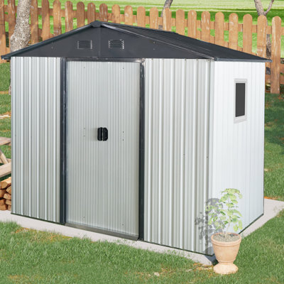 Remise de rangement extérieure en métal 8 pi x 4 pi Blanc et noir. Avec peinture. Possède une porte verrouillable à toit incliné. Comprend une fondation et des accessoires de 4 pi pour la cour, le patio et la pelouse. Solide. Avec