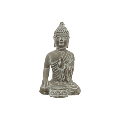 Budhha en ciment avec bougie avant