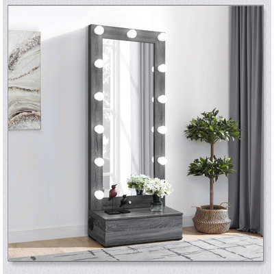 Grand miroir Lorena gris avec tiroir et haut-parleurs intégrés, parfait pour les espaces de vie modernes et fonctionnels