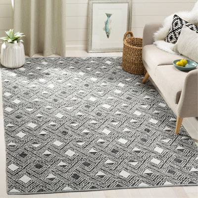 Tapis géométrique noir / ivoire tissé à plat à la main Dominica