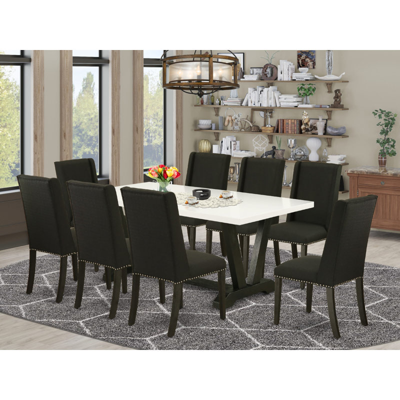 9-Piece Set a Wonderful Linen White Table top and 8 Black Parson’s dining room chairs with Nail Heads and Curved Back, Wire Brushed Black Finish