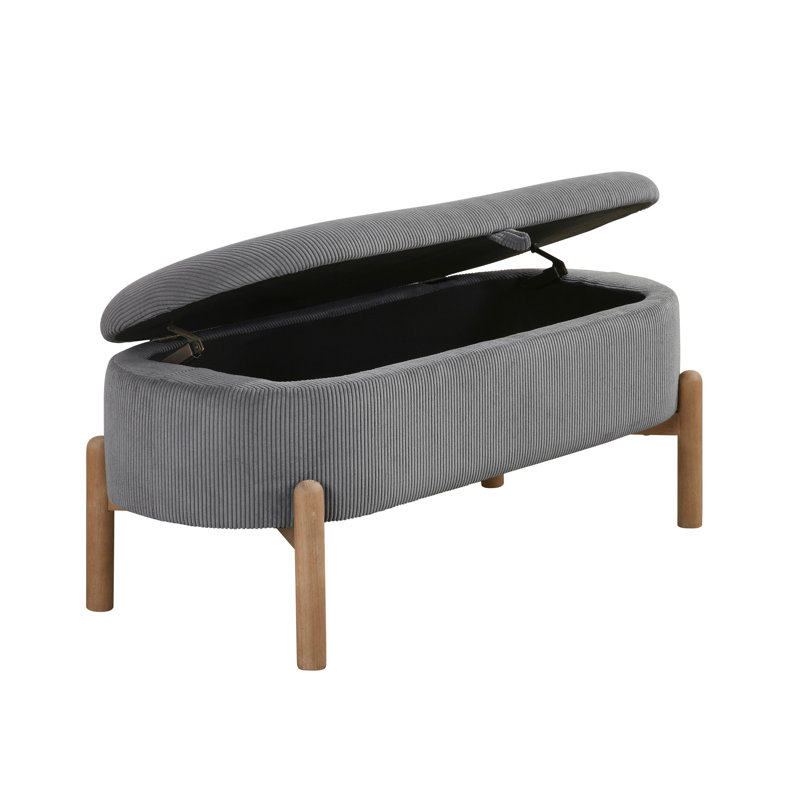 Banc de rangement élégant en velours côtelé gris avec des pieds en bois massif et une base polyvalente d'inspiration Mid-Century