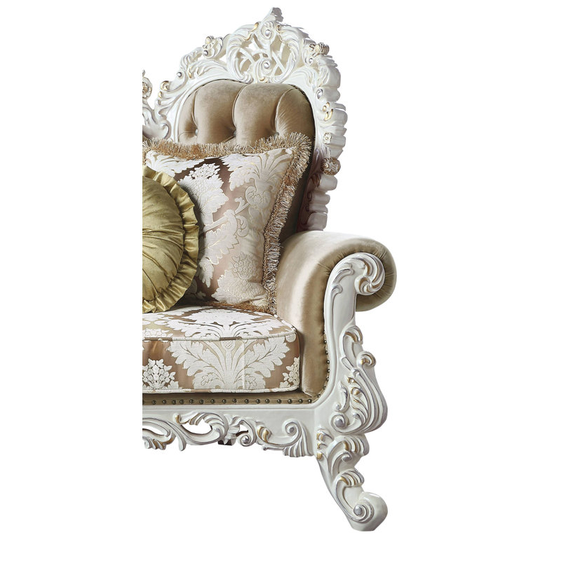 Antique White Tufted Sofa with Floral Cushions and Nailhead Trim