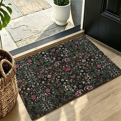 Tapis à motif floral discret sur fond sombre, 119 x 79 cm