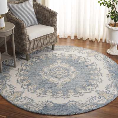 Ebony Floral Hand Tufted Wool Area Rug in Blue/Ivory