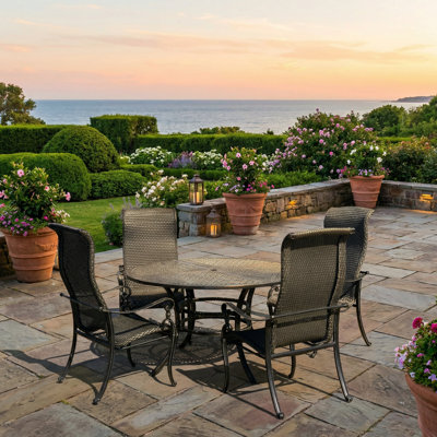 Hisham 4 - Person Patio Dining Set with Round Table